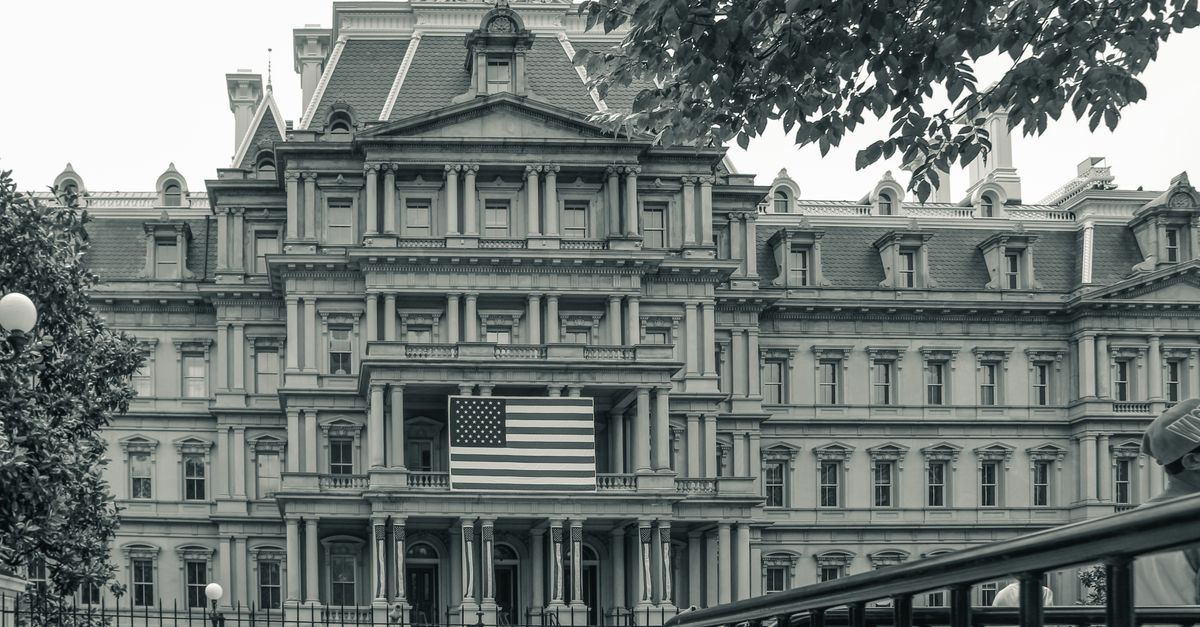 View of the Eisenhower Executive Office Building in Washington with American flag.
